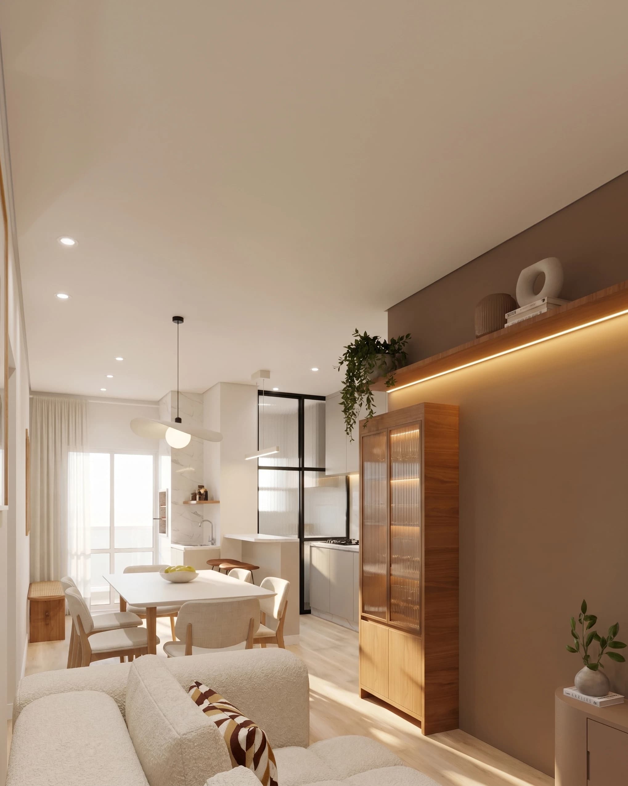 Sala de estar e jantar integradas à cozinha, com sofá claro e marcenaria em madeira.